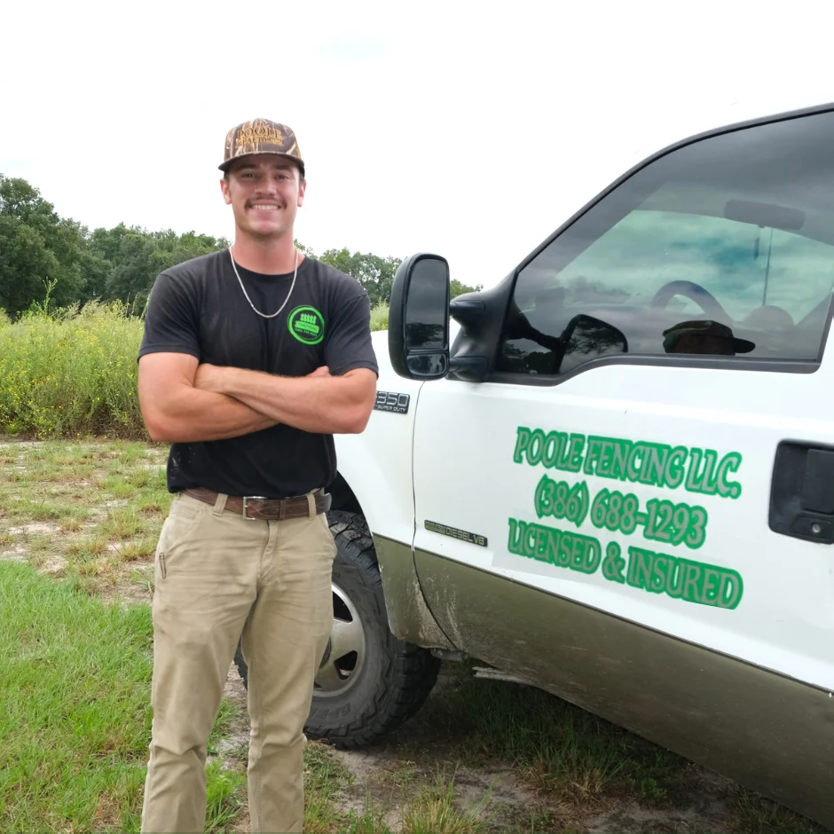 Waylon Poole, owner of Poole Fencing LLC, with service truck in Live Oak, Florida