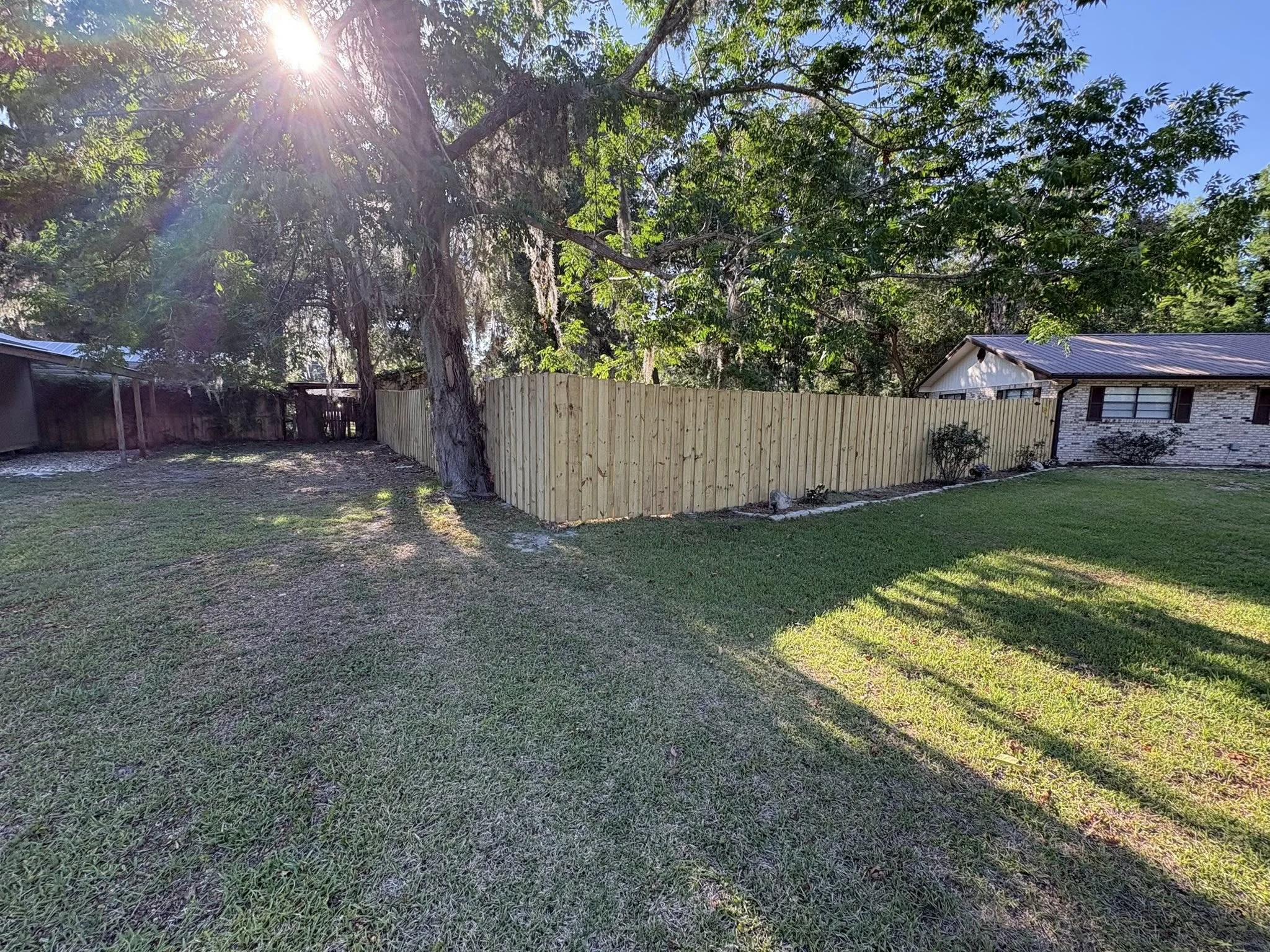 Custom wood fence installed by Poole Fencing
