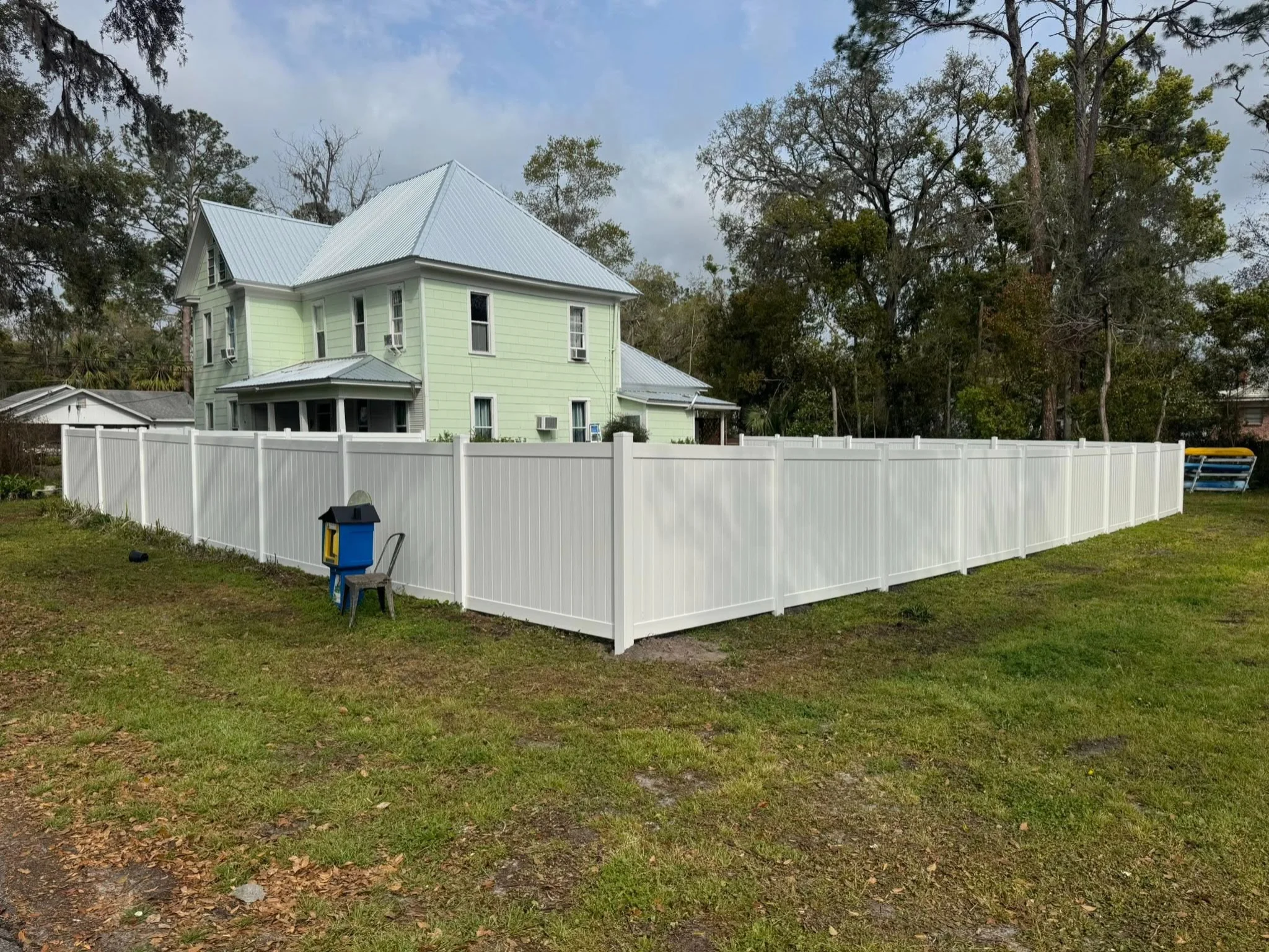 Wood fence repair after storm damage in North Florida